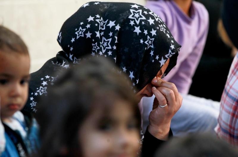 een Afghaanse vrouw en kinderen